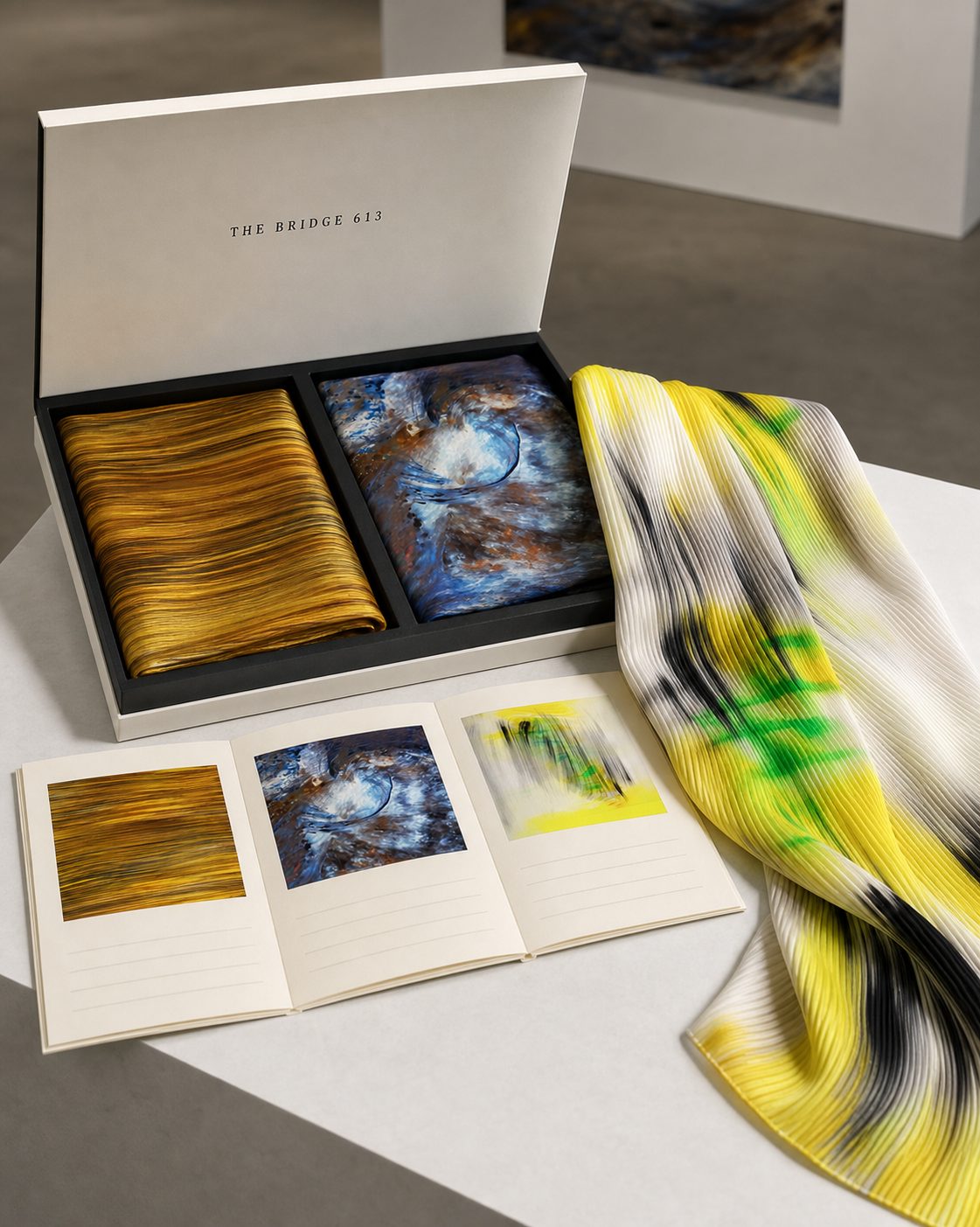 Open box with scarf, art cards and archive reference